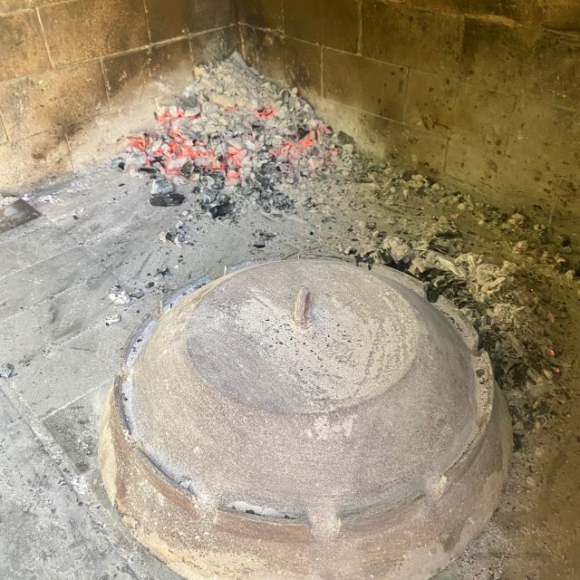 Lamb and potatoes under Peka