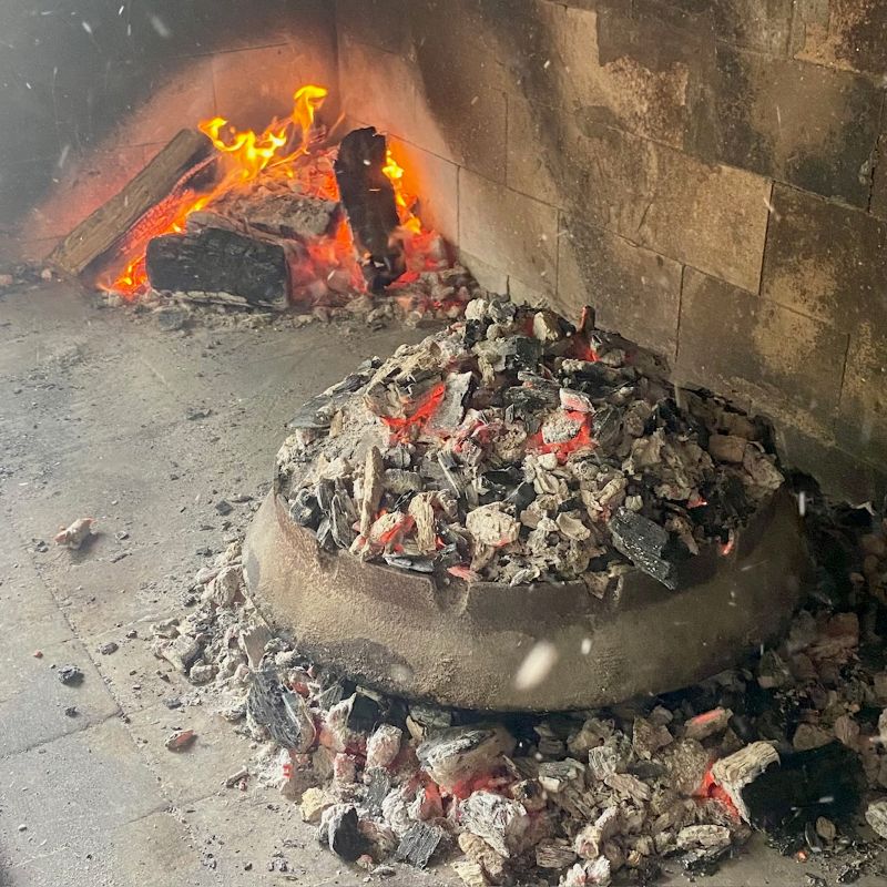 meat and potatoes under peka